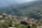 A picturesque view of Kirkar village showcasing lush greenery and traditional houses.