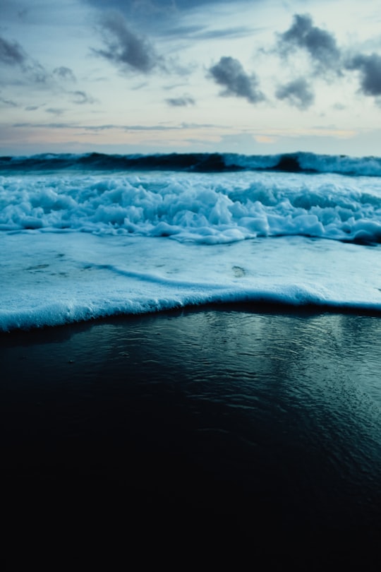 ocean waves crashing on shore during daytime in Natal Brasil