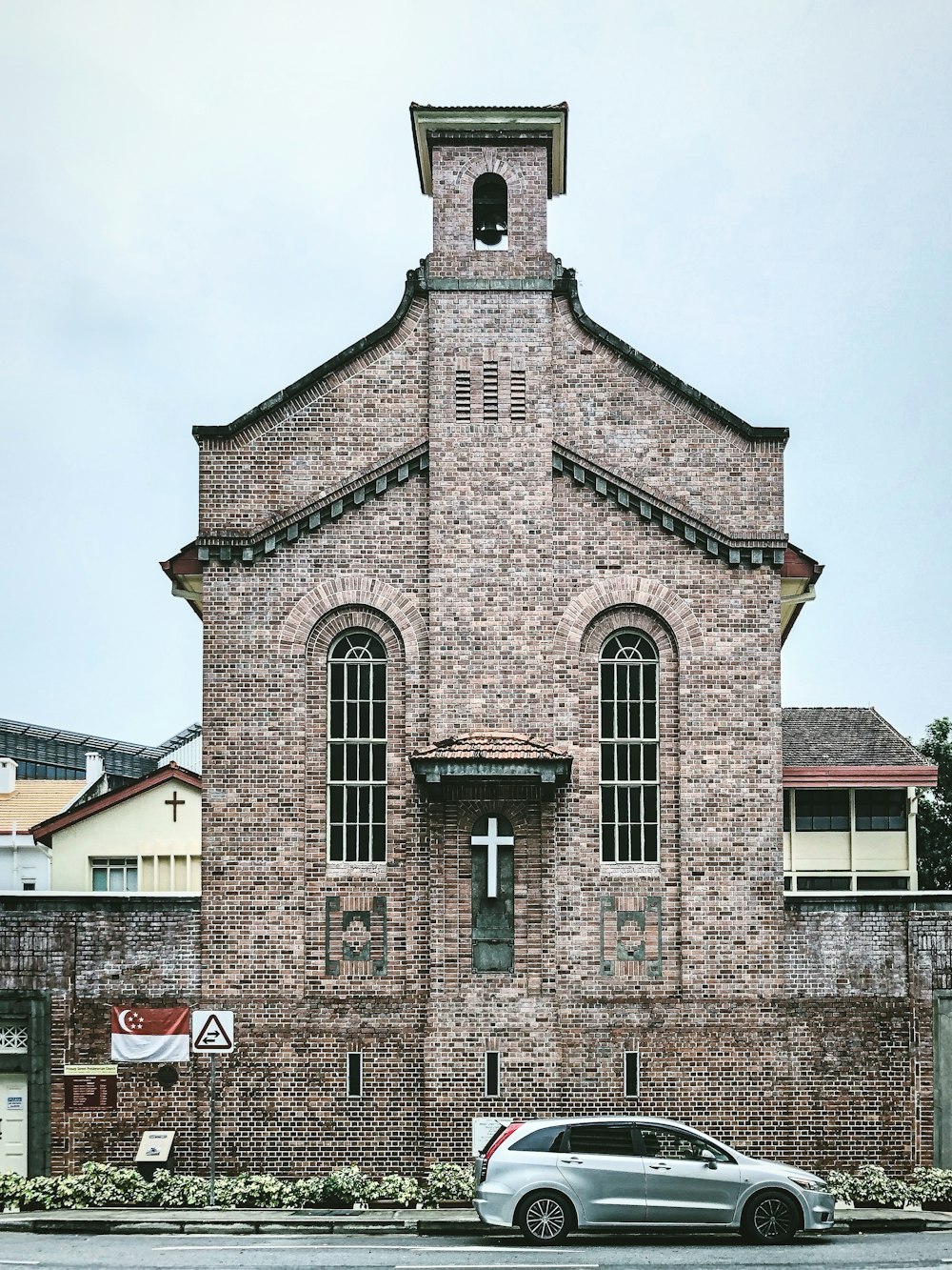 brown brick building under white sky during daytime