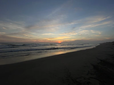 A peaceful beach scene at sunset, perfect for mental escapes.