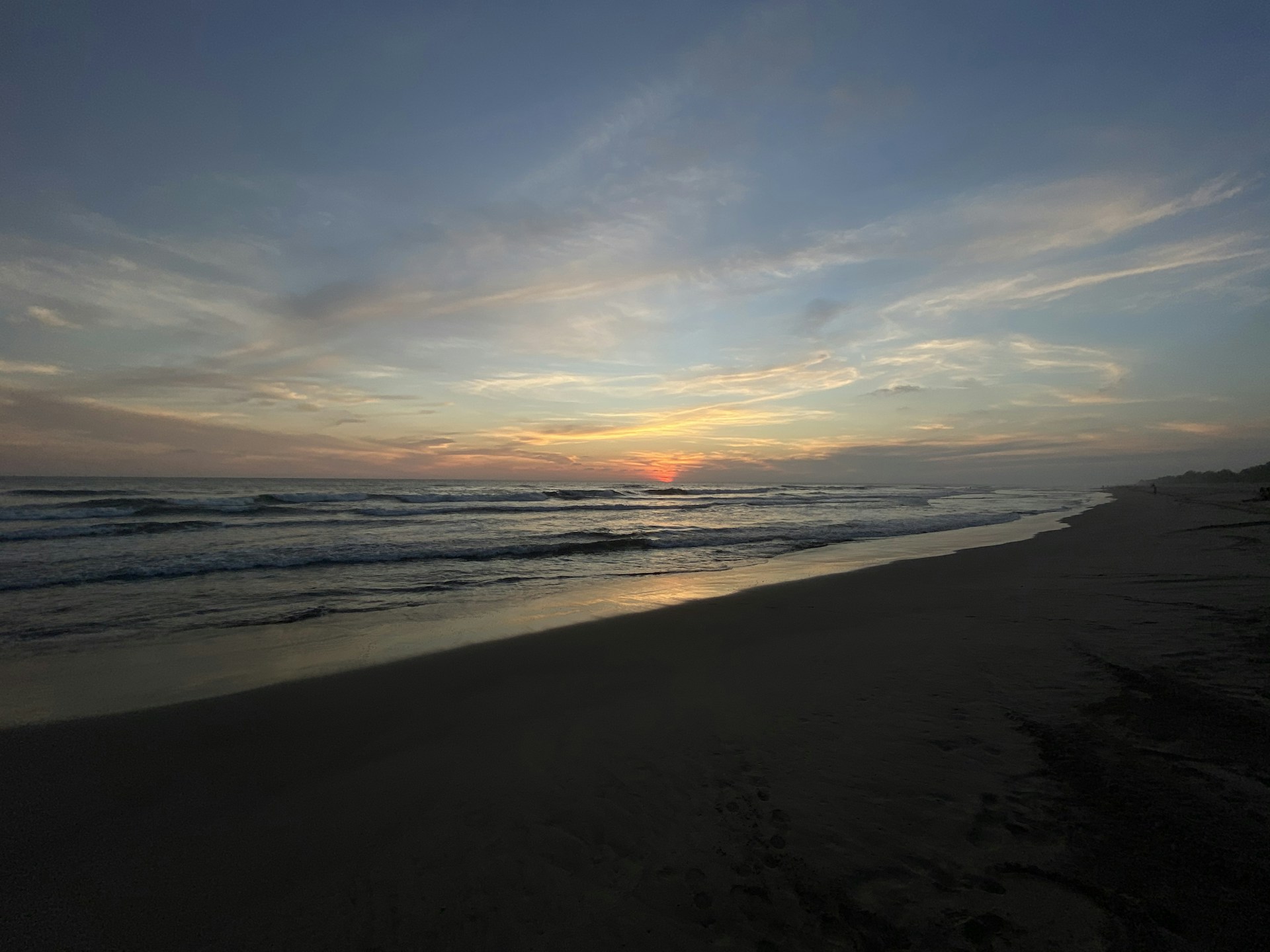 woman wearing yellow long-sleeved dress under white clouds and blue sky during daytime