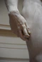 persons feet on white textile