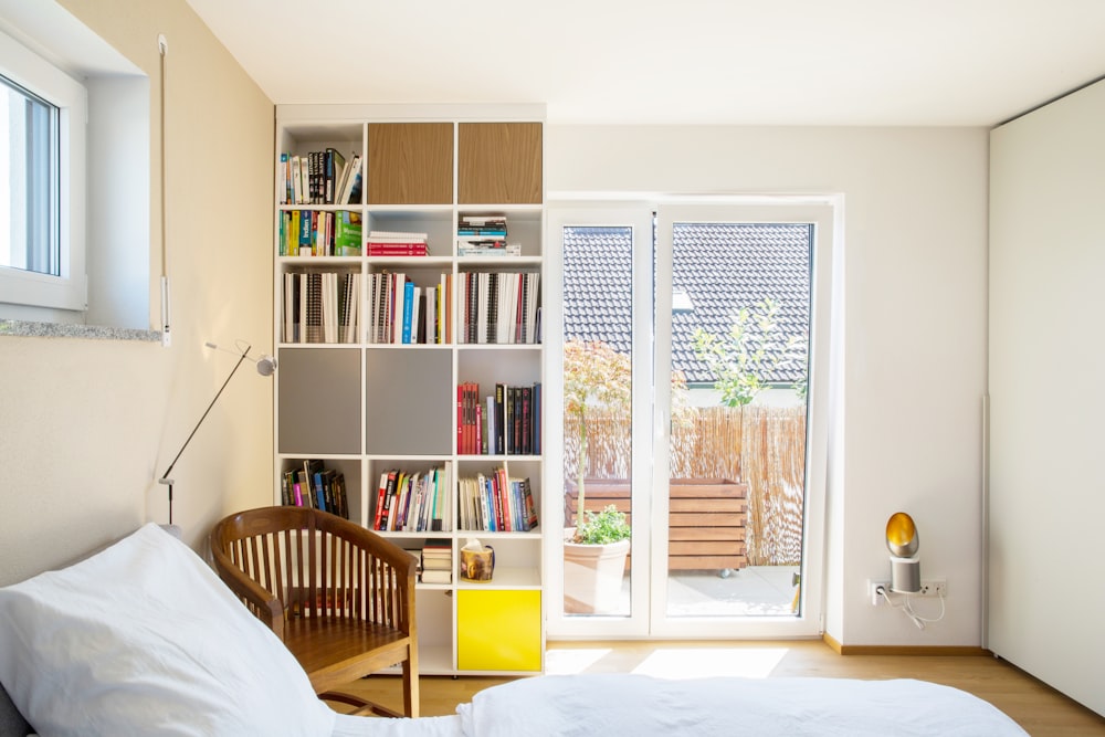 white wooden shelf with books