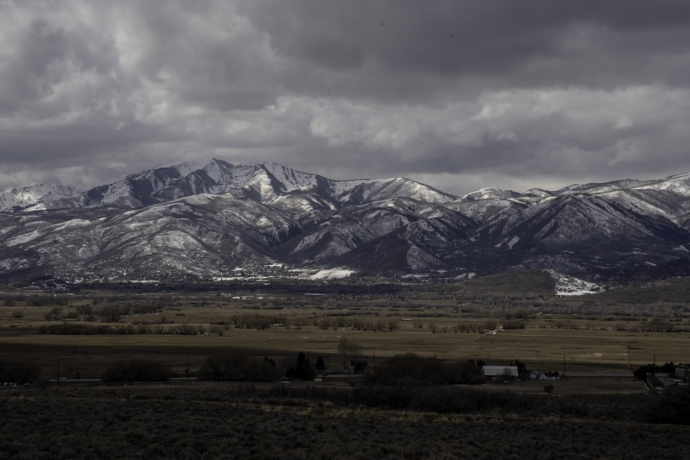 white and black mountains under white cloudy sky during daytime