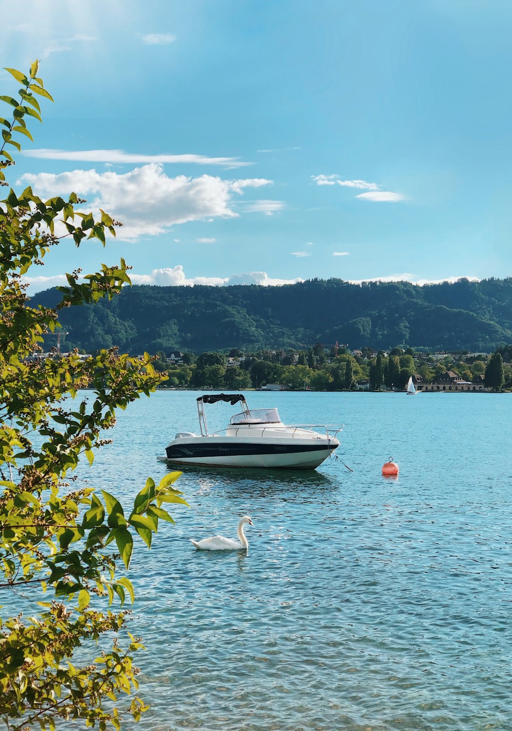 white boat on body of water during daytime