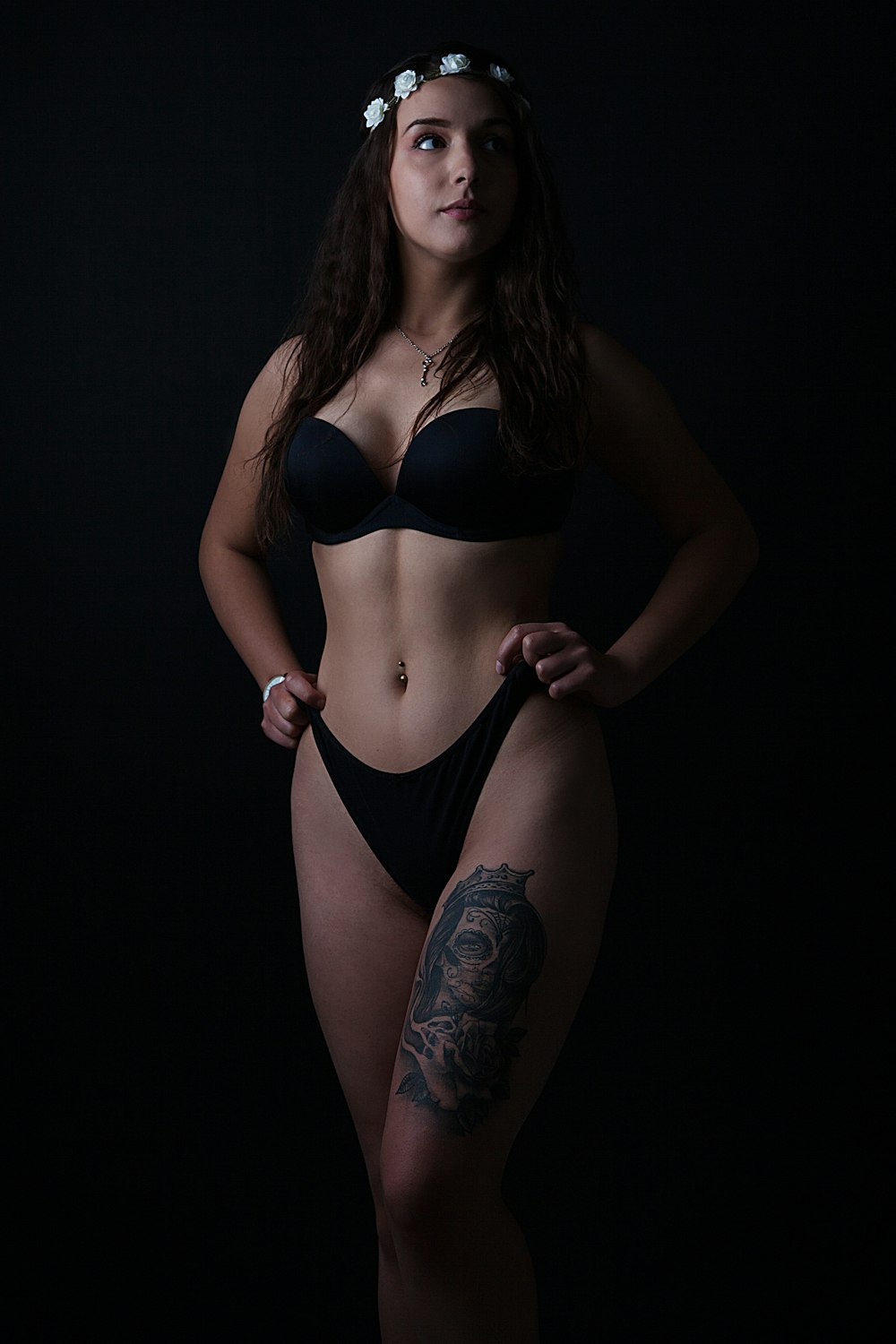 woman in black bikini with tattoo on her back