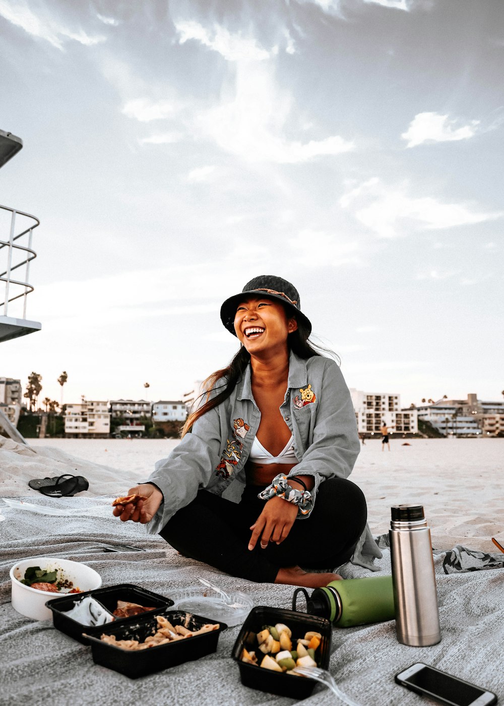 woman in gray jacket sitting on chair