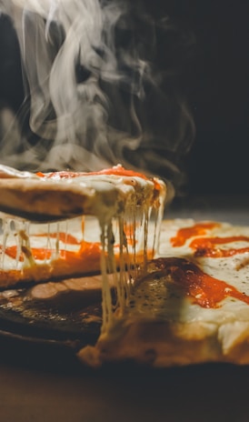 close up photo of pizza with cheese