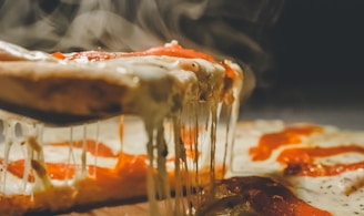 close up photo of pizza with cheese