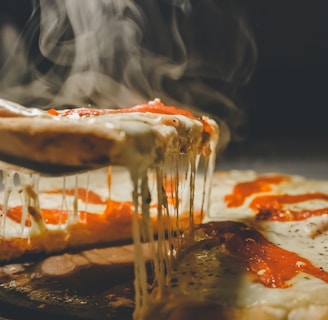 close up photo of pizza with cheese