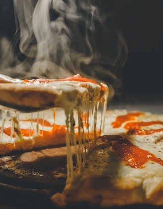 close up photo of pizza with cheese