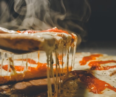 close up photo of pizza with cheese