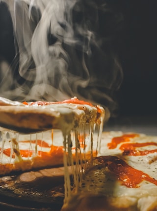 close up photo of pizza with cheese