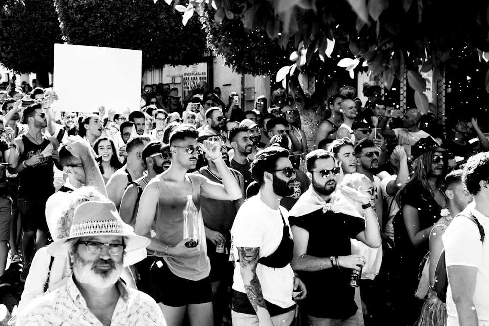 grayscale photo of people in a street