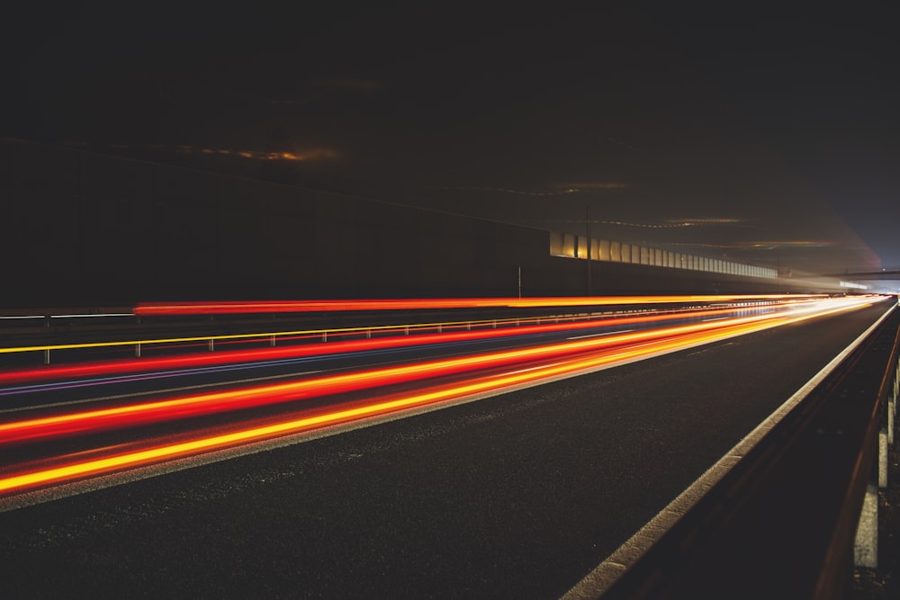 time lapse photography of cars on road during night time