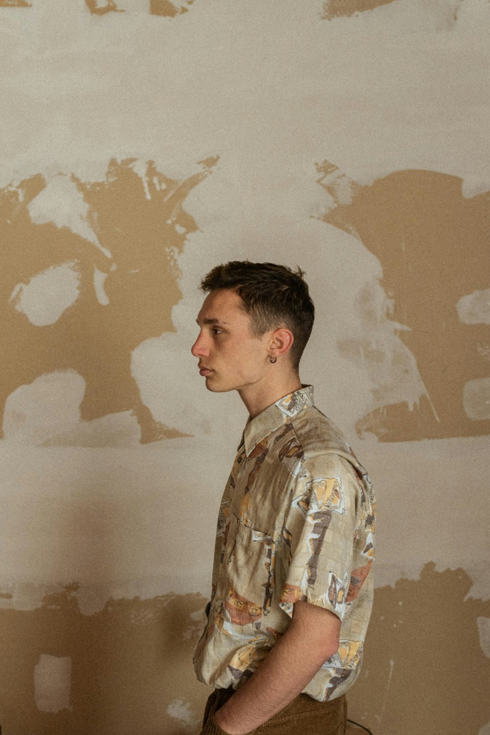 man in brown and white floral button up shirt