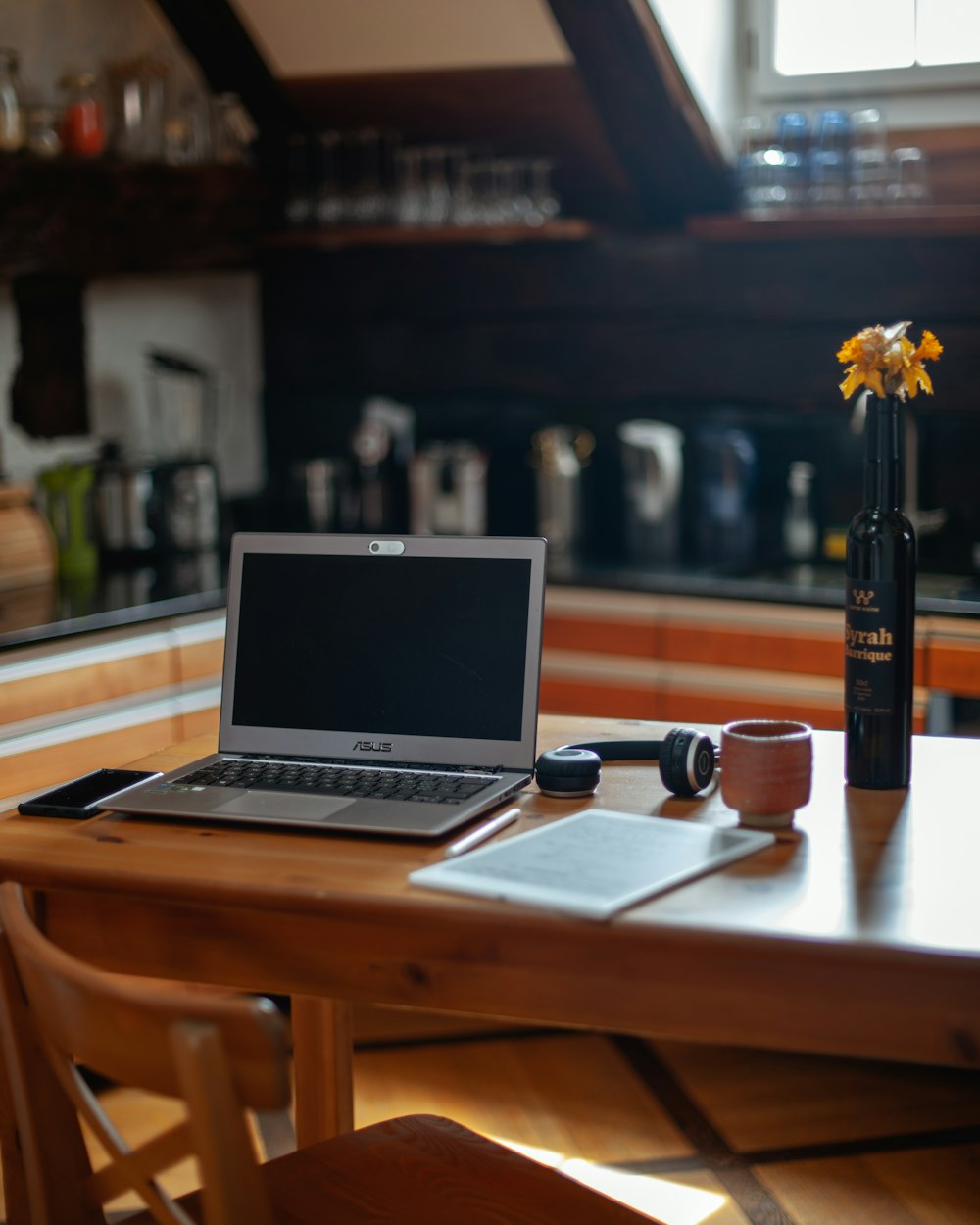 macbook pro on brown wooden table