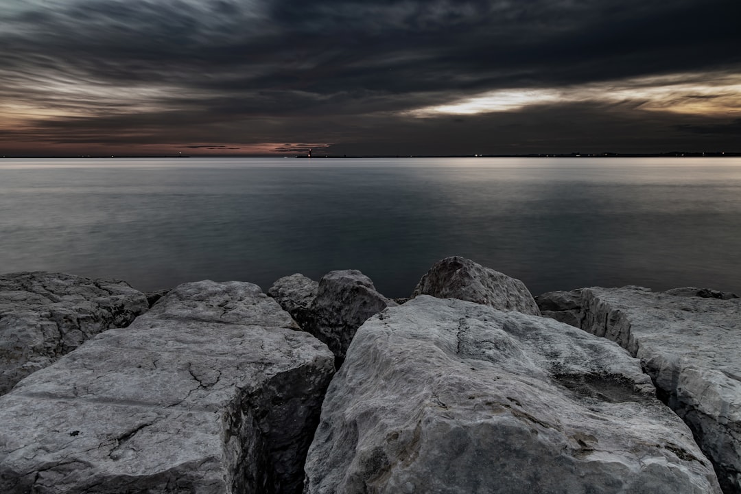 gray rocky shore during sunset