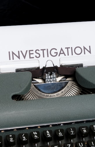 green and white typewriter on blue textile