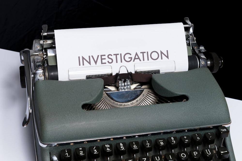 investigation typed on white paper