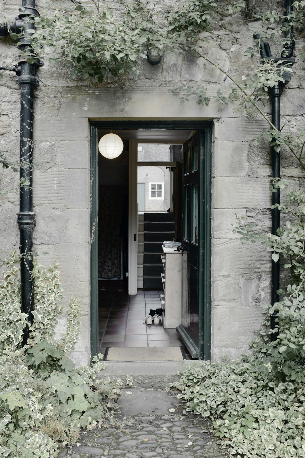 black metal door on gray concrete building