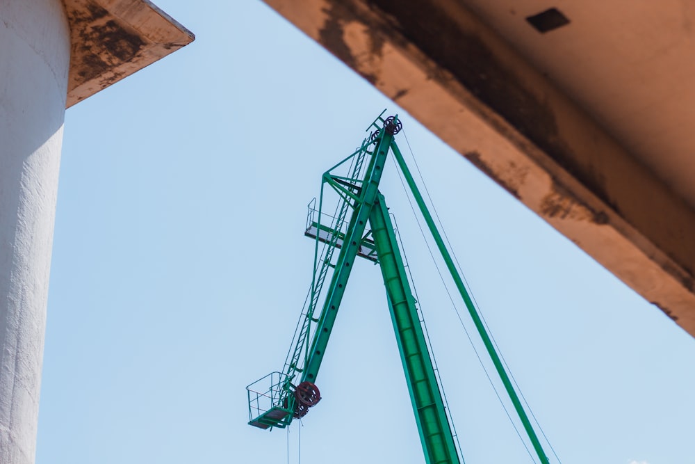 black and red crane under blue sky during daytime