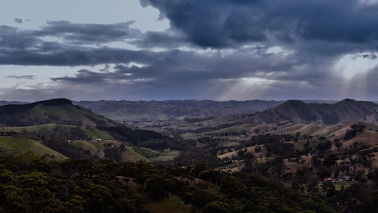 green mountains under white clouds during daytime in Mount Buffalo Australia