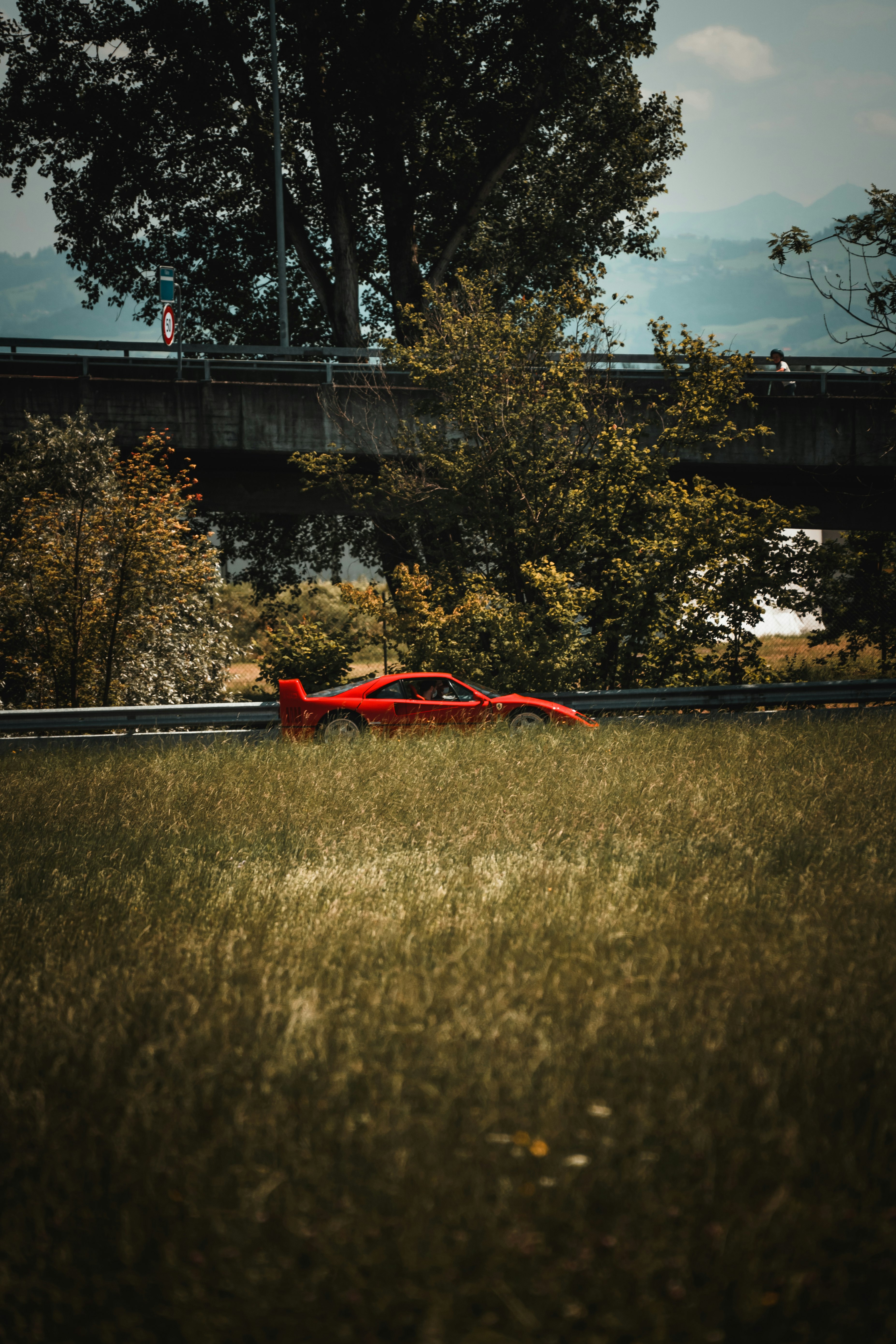 red car on black road