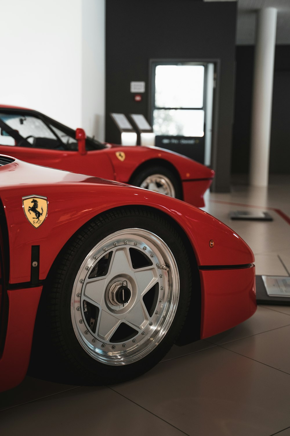 red ferrari 458 italia in a room