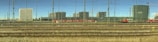 A panoramic view of a bustling railway yard with trains.