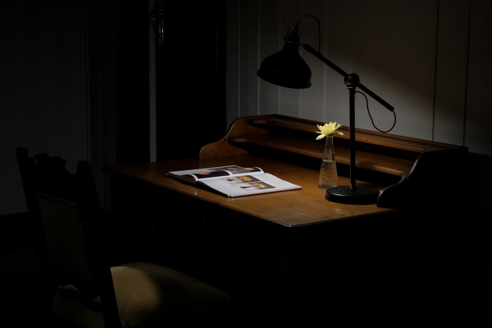 black and silver table lamp on brown wooden table