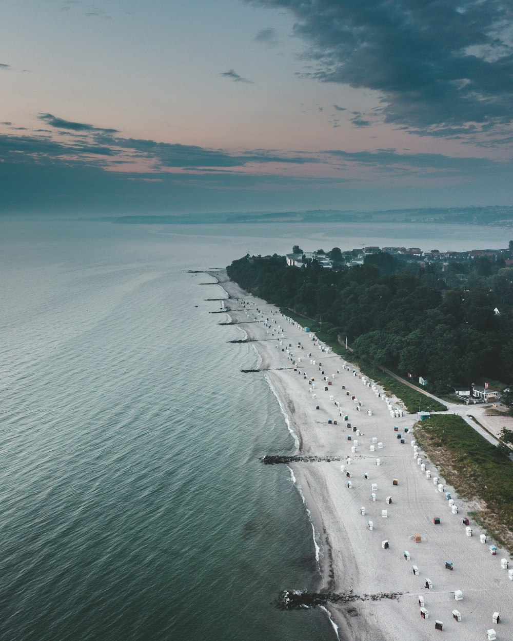 aerial view of city near body of water during daytime