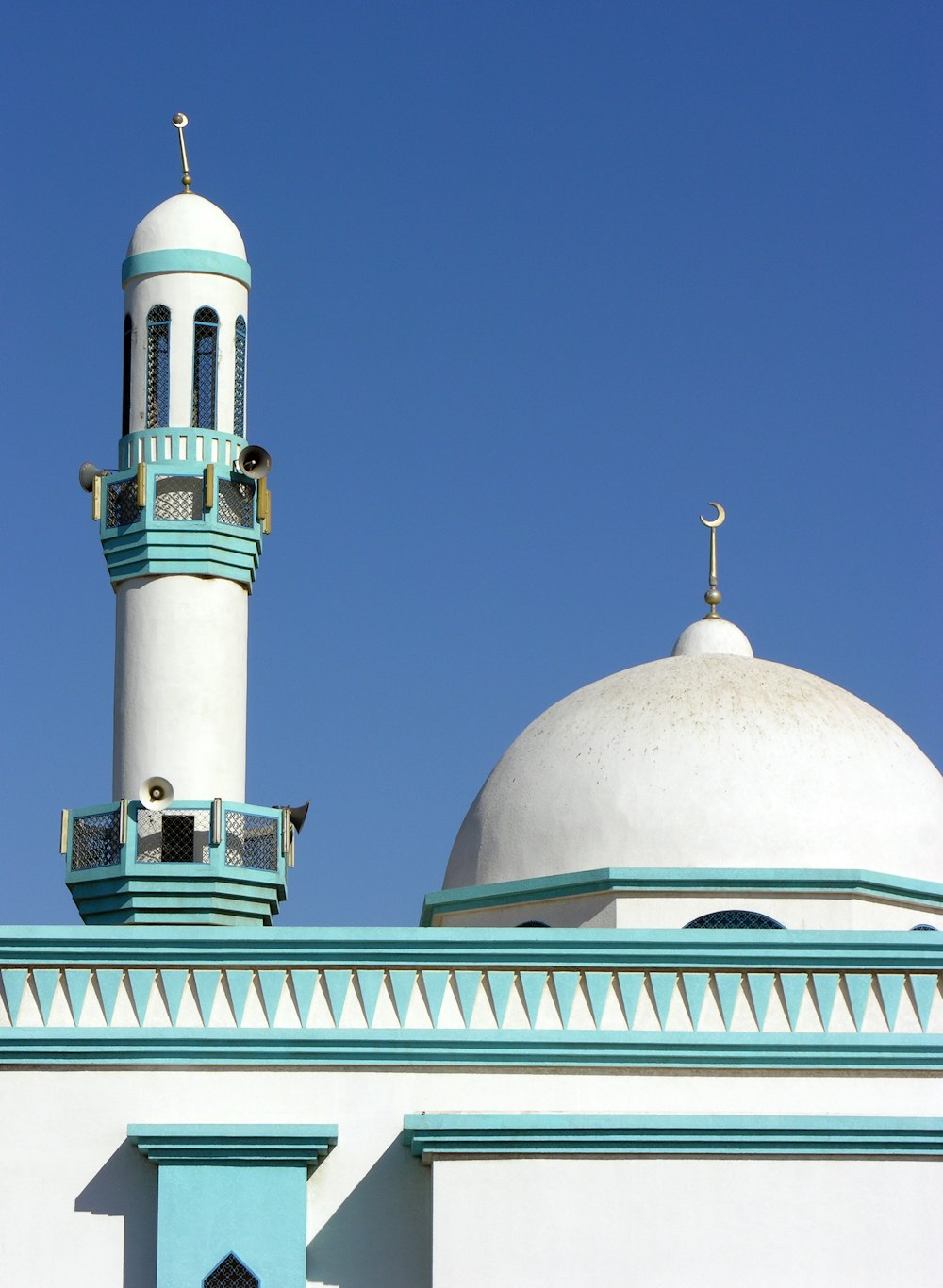 white and green dome building under blue sky during daytime