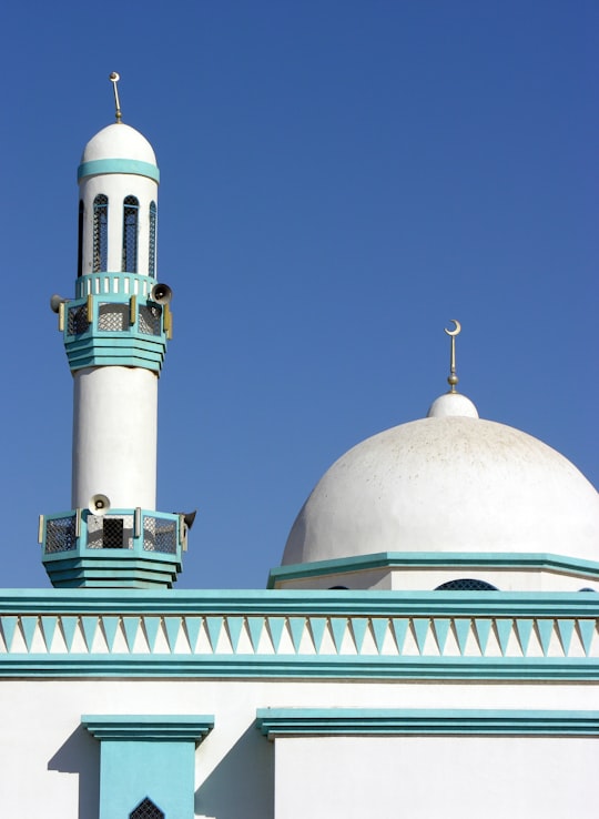 white and green dome building under blue sky during daytime in Ras al Khaimah - United Arab Emirates United Arab Emirates