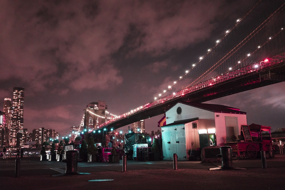 red bridge over the city during night time