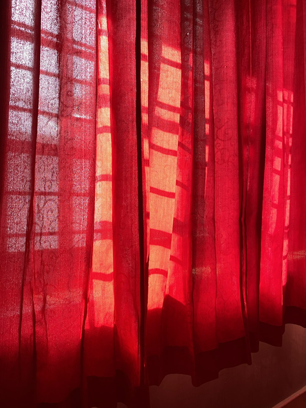 red and brown window curtain