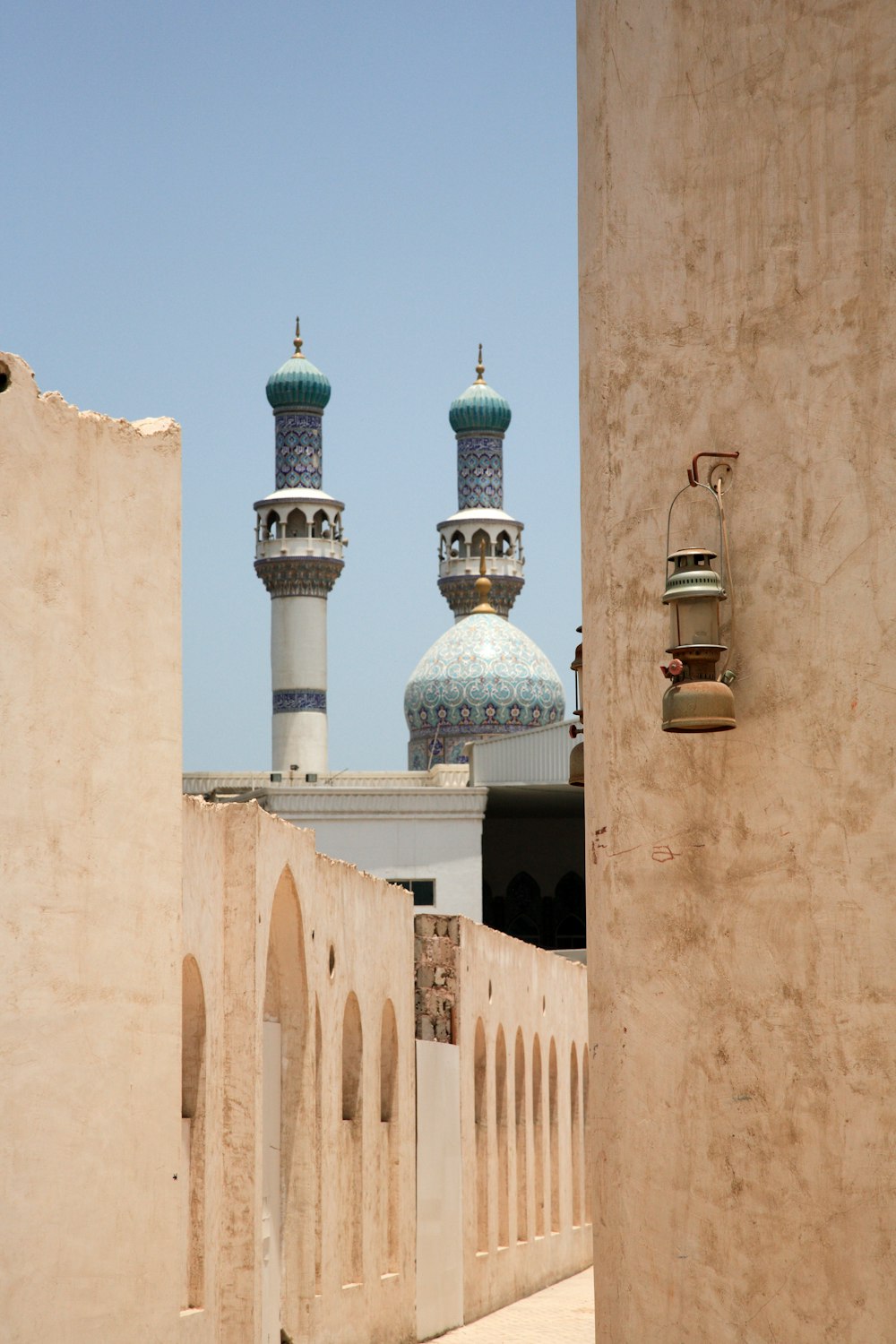 white and blue mosque during daytime