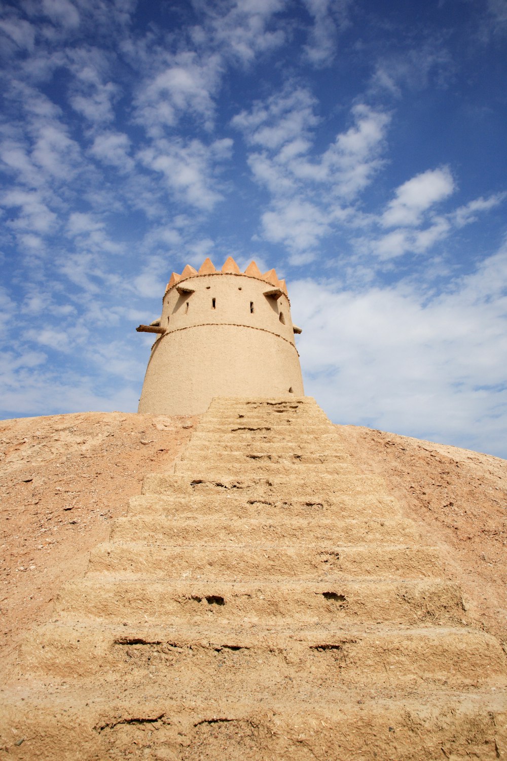 brown concrete tower under blue sky during daytime