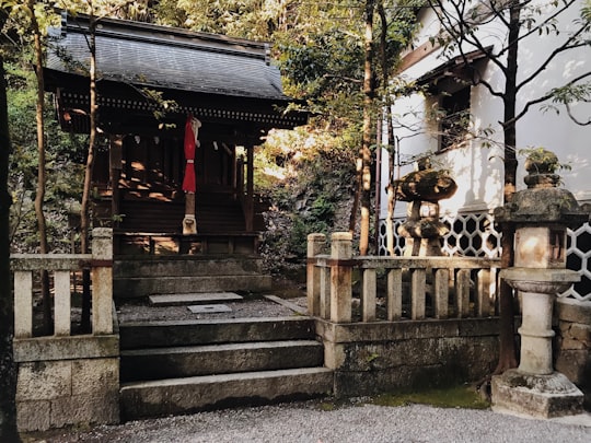 gray concrete stairs near brown wooden house during daytime in Omihachiman Japan