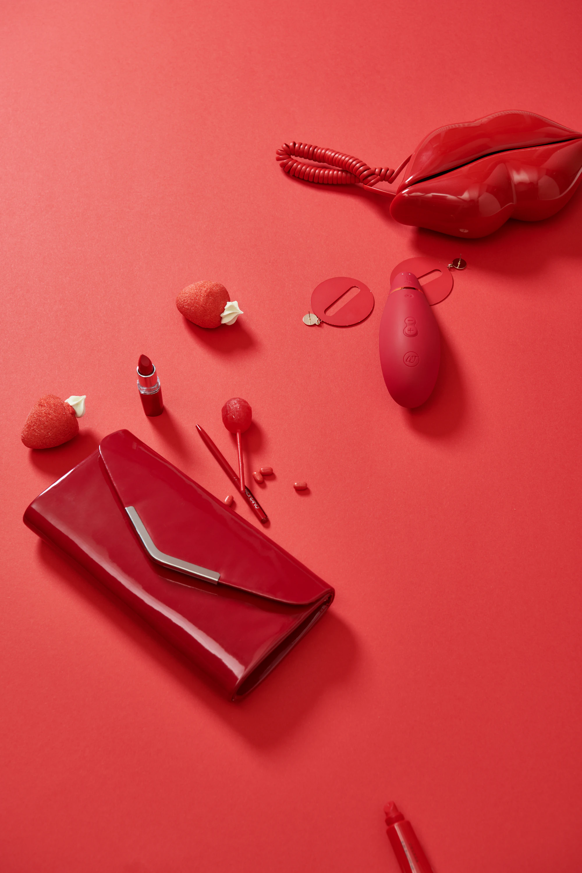 Red gift set with a clutch and an intimate wellness product