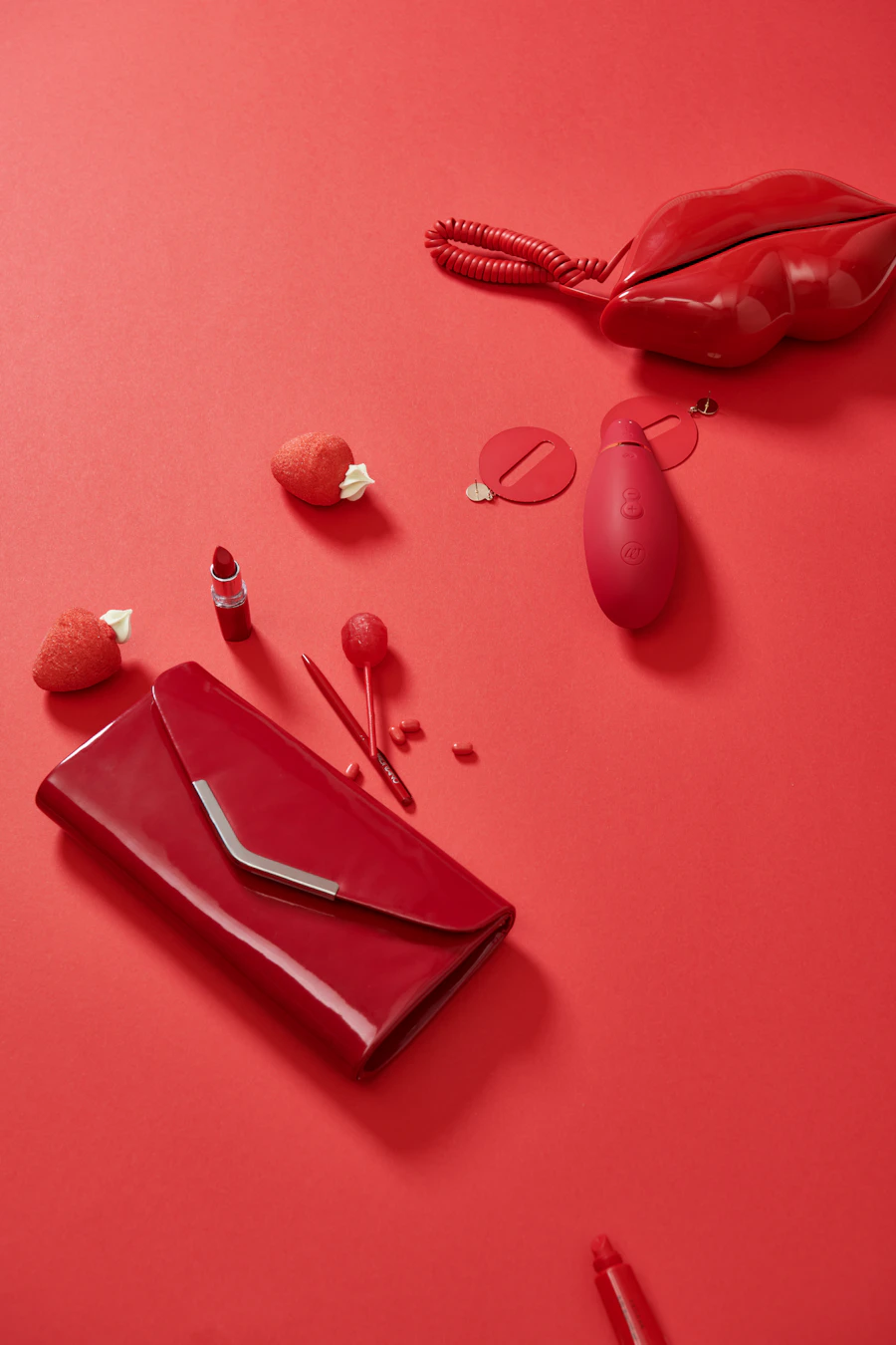 Red gift set with a clutch and an intimate wellness product