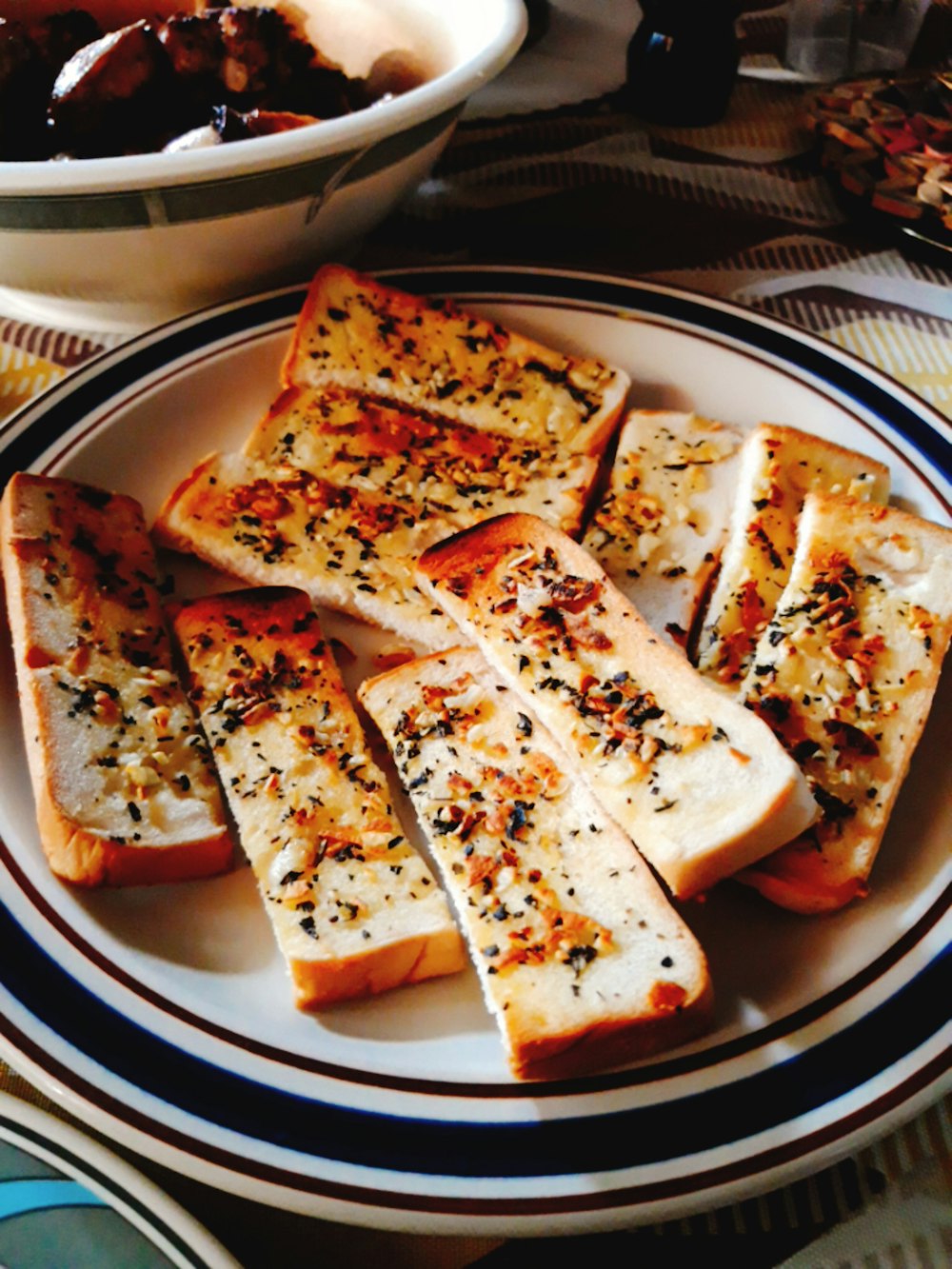 sliced pizza on blue and white ceramic plate