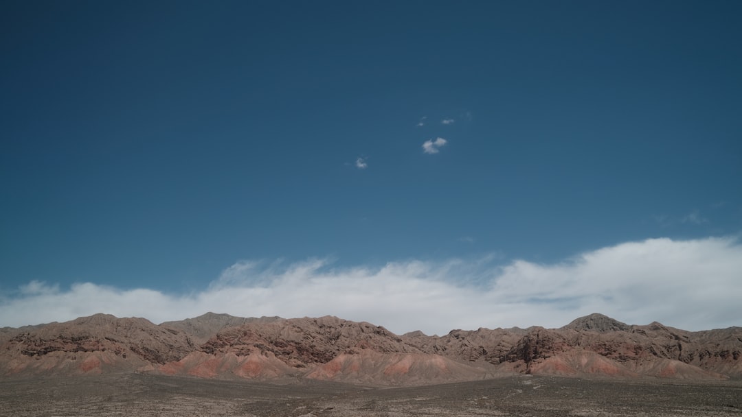 brown mountain under blue sky during daytime