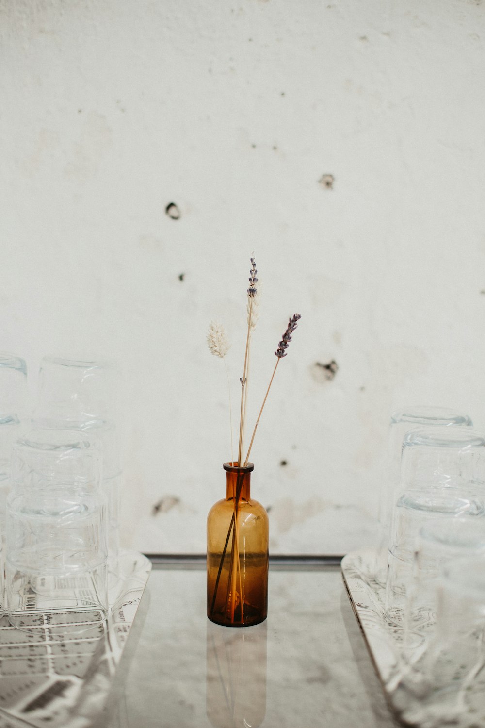 clear glass bottle with brown liquid inside