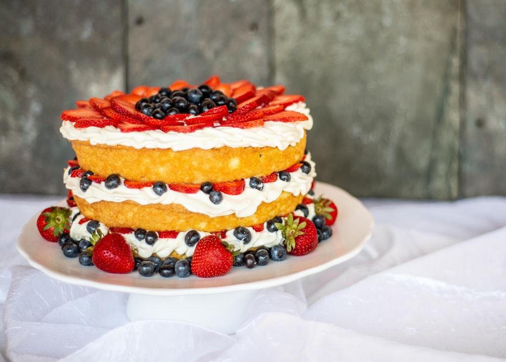 white and red cake on white ceramic plate