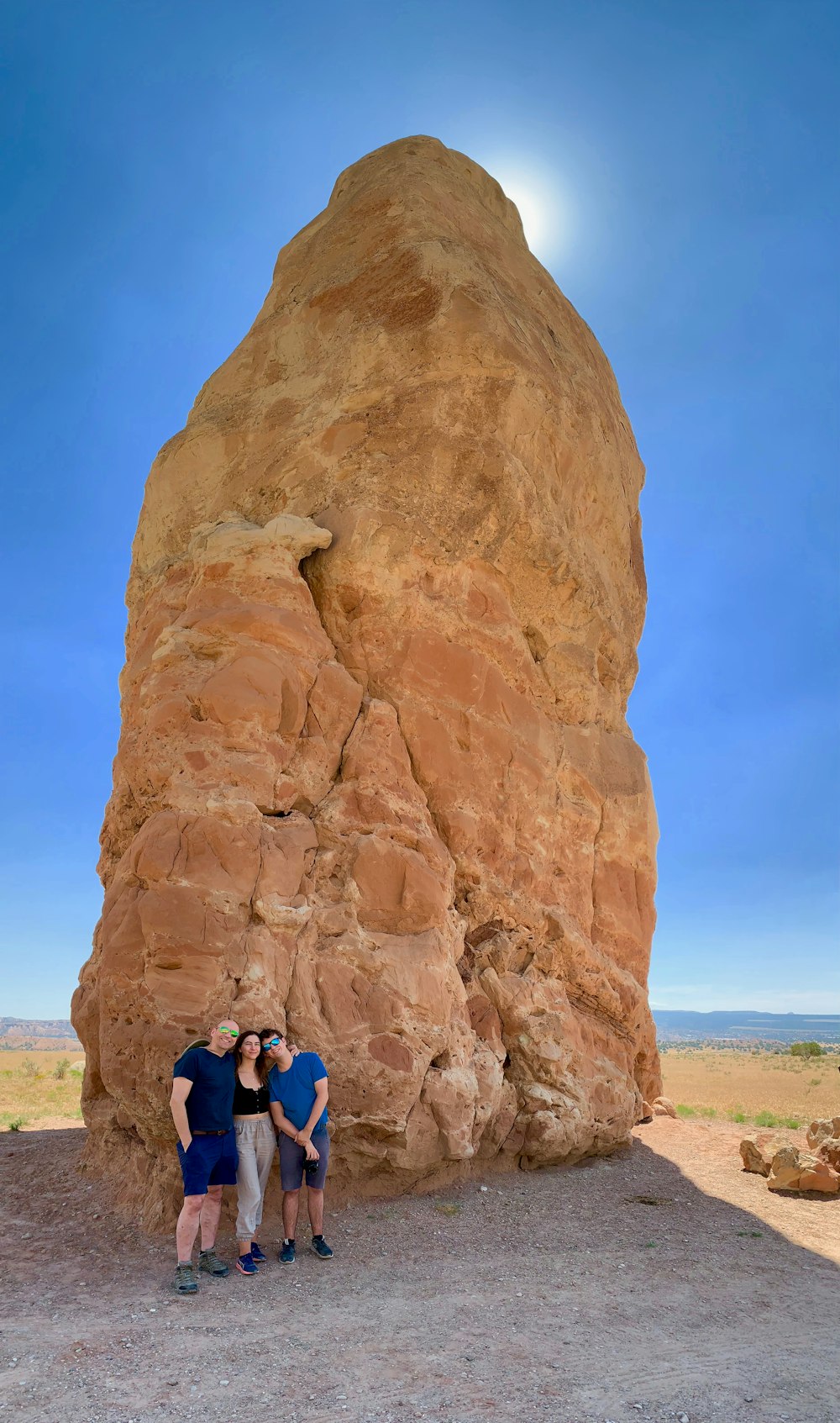 people climbing brown rock formation during daytime