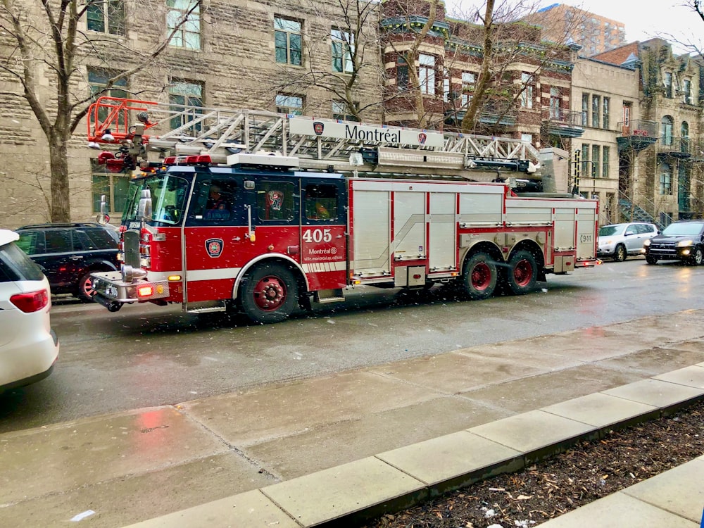 red and white fire truck on road during daytime