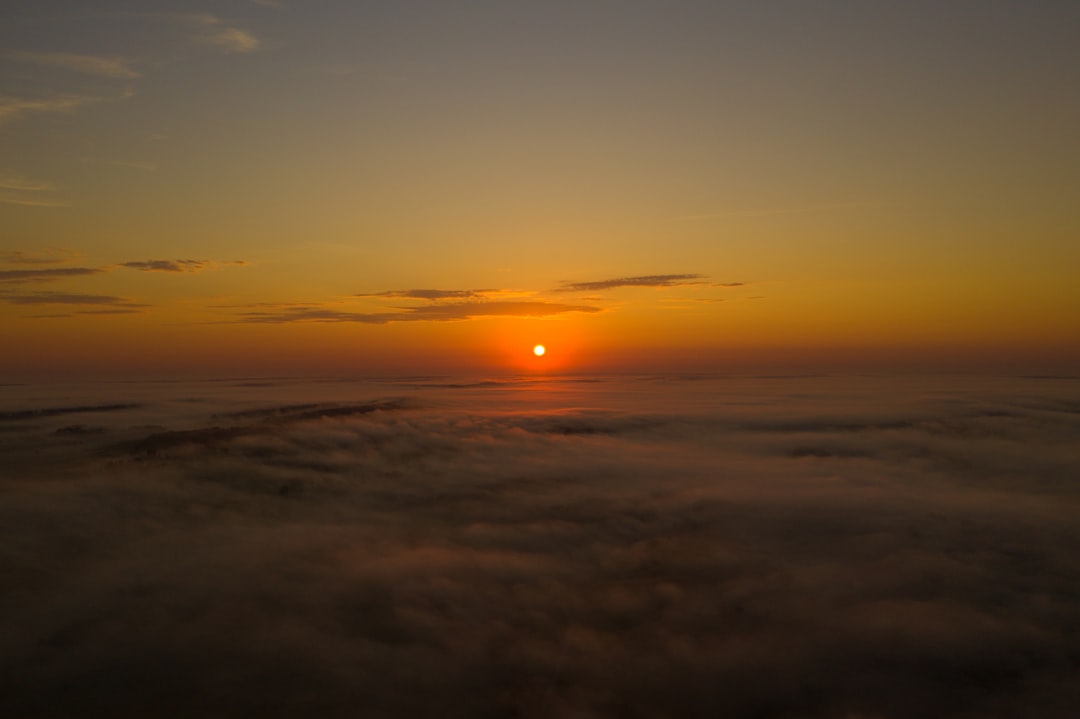 sun setting over the clouds