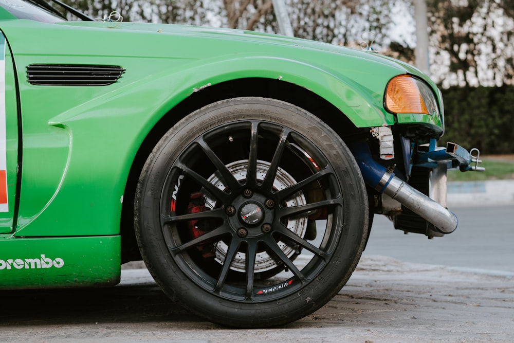 green car with black wheel