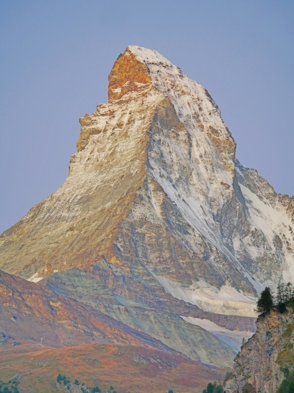 brown rocky mountain under blue sky during daytime